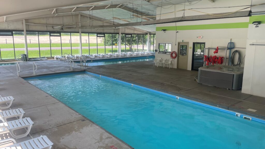 two blue pools inside a metalbuilding