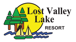 logo for lost valley lake. a animated drawing of two sailboats and a sun behind it.